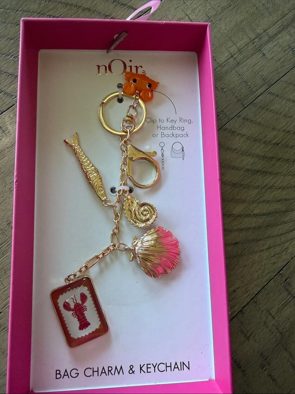 nOir Jewelry Gold-Tone Keychain with Pink Shell & Lobster Tag